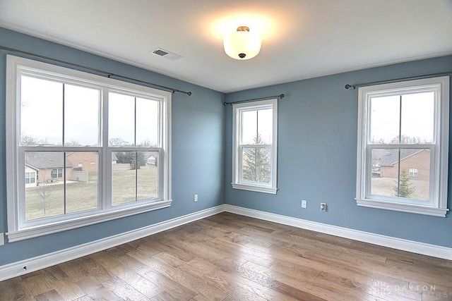 9471 Banyan Ct, Dayton, OH 45458 - empty room with visible vents, baseboards, and dark wood-style flooring