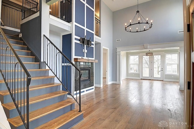 9471 Banyan Ct, Dayton, OH 45458 - entryway with an inviting chandelier, stairs, a fireplace, and wood finished floors