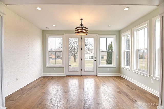 9471 Banyan Ct, Dayton, OH 45458 - doorway to outside with recessed lighting, baseboards, brick wall, and wood finished floors