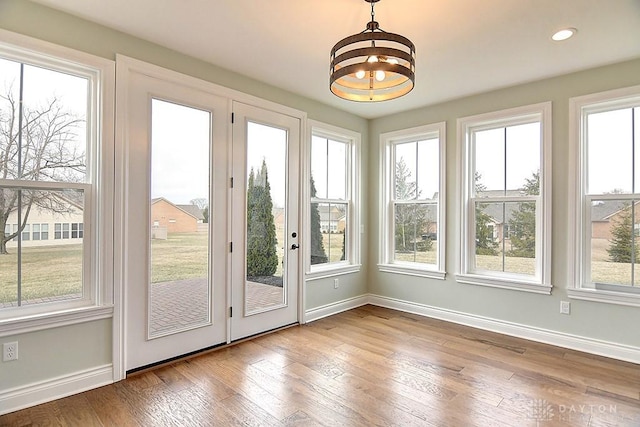 9471 Banyan Ct, Dayton, OH 45458 - unfurnished sunroom featuring a healthy amount of sunlight and an inviting chandelier