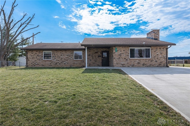 ranch-style house featuring brick siding, a chimney, a front yard, and fence