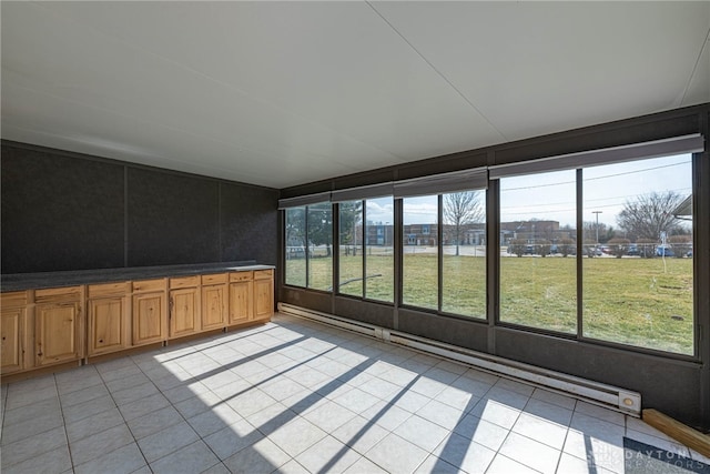 unfurnished sunroom featuring a city view