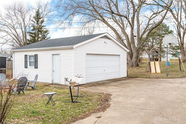 detached garage featuring driveway