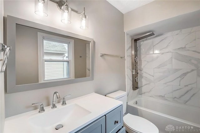 bathroom with shower / bathtub combination, vanity, and toilet