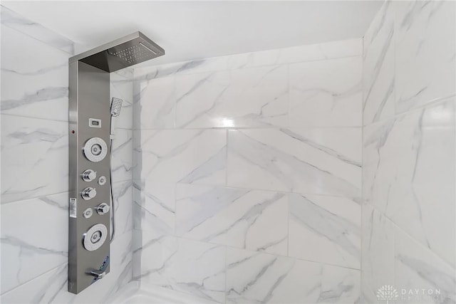 room details with a marble finish shower