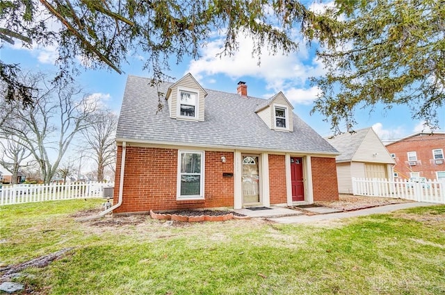 cape cod-style house with brick siding, a chimney, a shingled roof, fence, and a front lawn