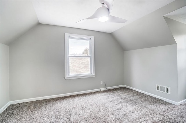 bonus room featuring a ceiling fan, lofted ceiling, visible vents, and baseboards