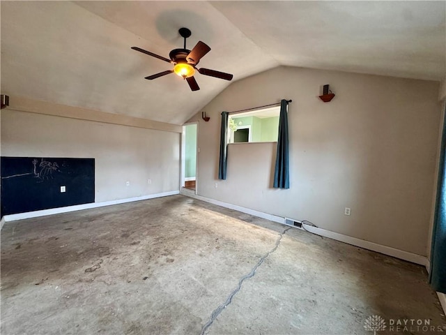 bonus room with a ceiling fan, vaulted ceiling, baseboards, and unfinished concrete floors