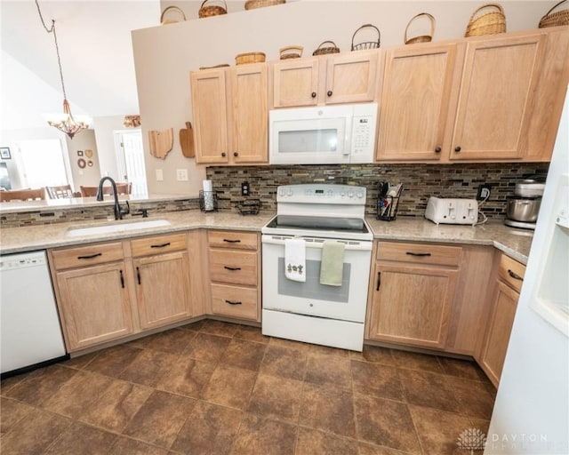 kitchen with light brown cabinetry, white appliances, a sink, and tasteful backsplash