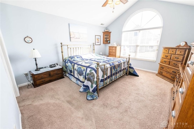 carpeted bedroom featuring vaulted ceiling, a ceiling fan, and baseboards