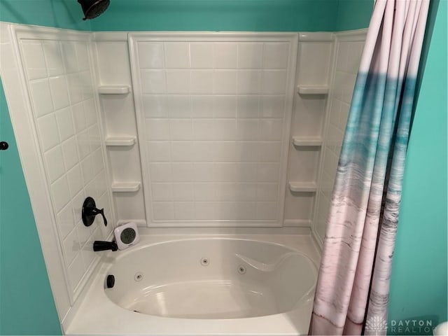 bathroom with a combined bath / shower with jetted tub