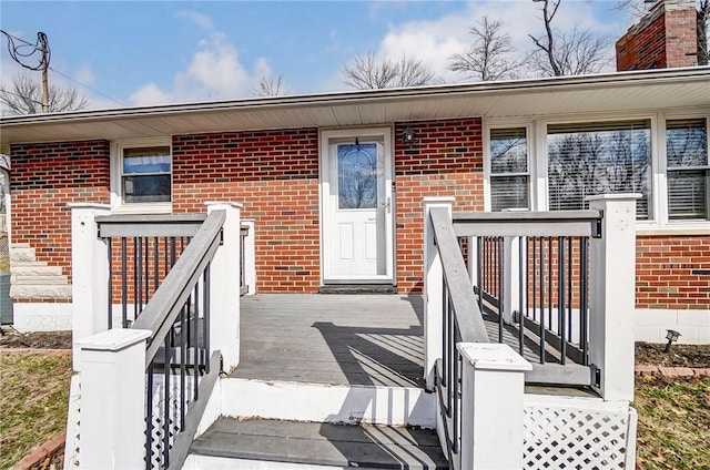 entrance to property with brick siding