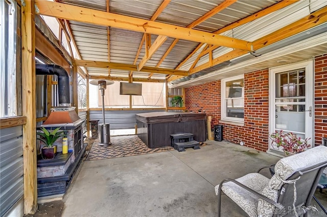 view of patio / terrace with a hot tub