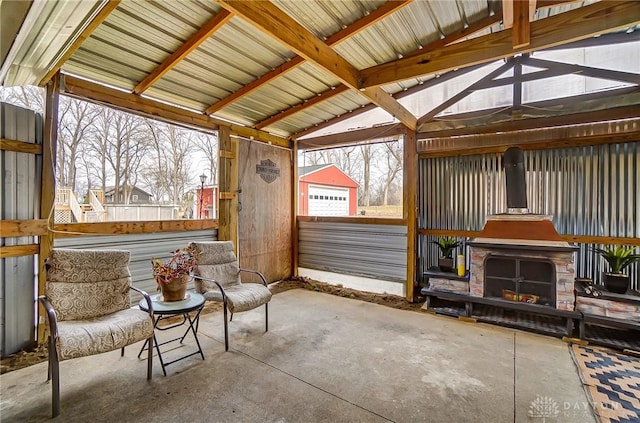 sunroom featuring lofted ceiling