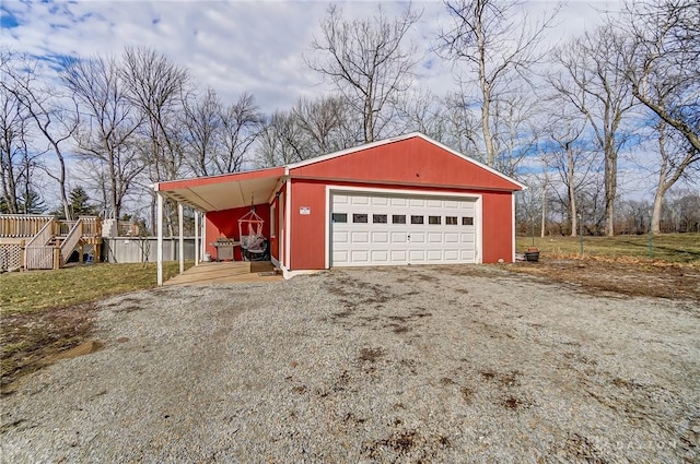 detached garage featuring driveway