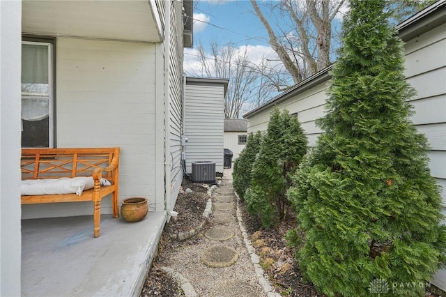 view of side of property with central AC unit