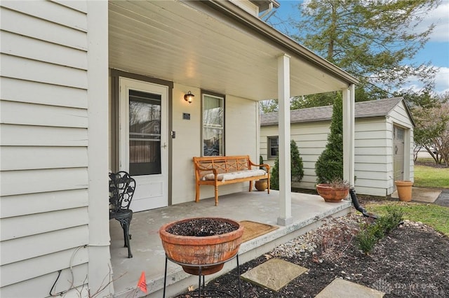 view of exterior entry with a porch