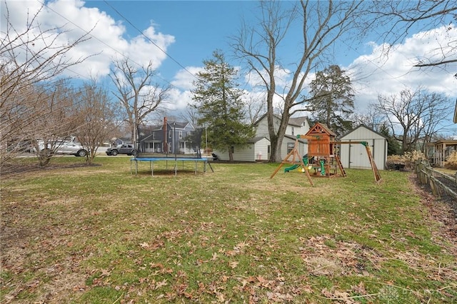 view of yard with a trampoline, a storage unit, a playground, and an outdoor structure