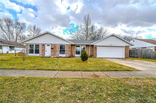 single story home with driveway, a front yard, a garage, and brick siding