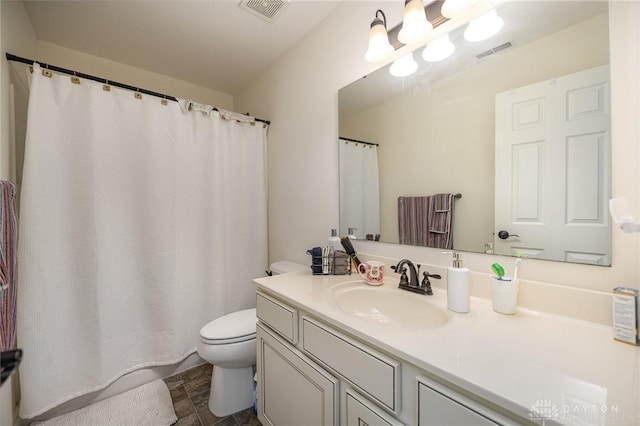 bathroom featuring toilet, an inviting chandelier, visible vents, and vanity