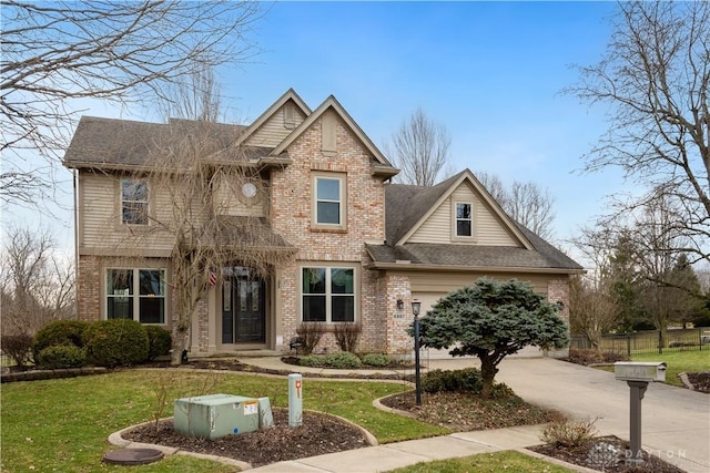 craftsman-style home featuring a garage, brick siding, a shingled roof, driveway, and a front lawn