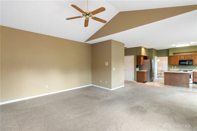 unfurnished living room with light carpet, high vaulted ceiling, ceiling fan, and baseboards