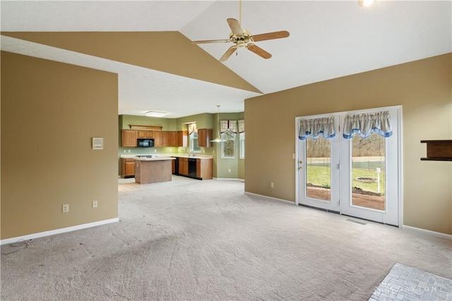 unfurnished living room featuring light carpet, high vaulted ceiling, baseboards, and a ceiling fan