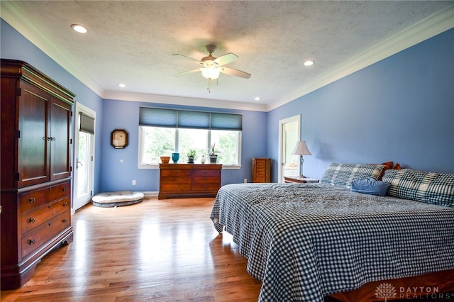 bedroom with a textured ceiling, light wood-style flooring, recessed lighting, baseboards, and crown molding