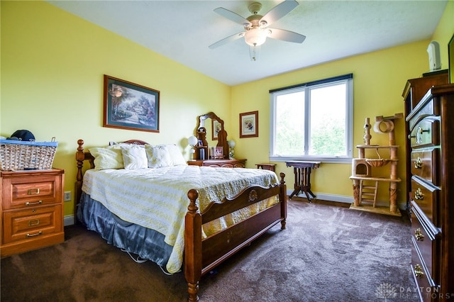 bedroom featuring dark colored carpet, ceiling fan, and baseboards