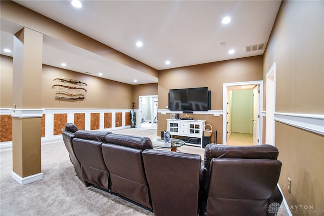 carpeted living area with visible vents and recessed lighting