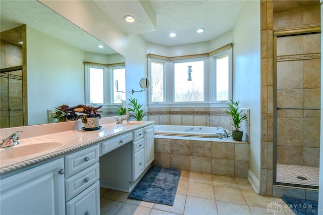 full bathroom with tile patterned flooring, a sink, a tile shower, and a bath