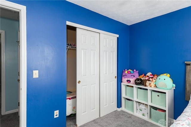 unfurnished bedroom with carpet floors and a closet