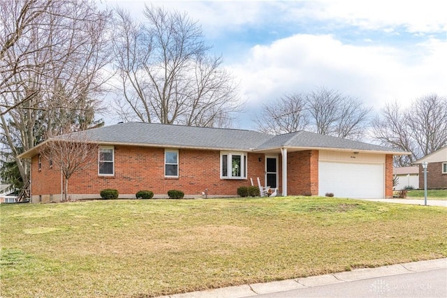 single story home with driveway, brick siding, an attached garage, and a front yard