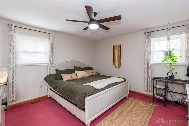 bedroom featuring a ceiling fan, carpet, visible vents, and baseboards