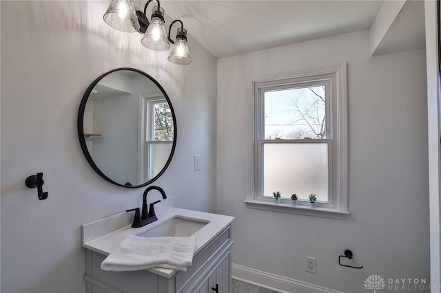 bathroom with vanity and baseboards