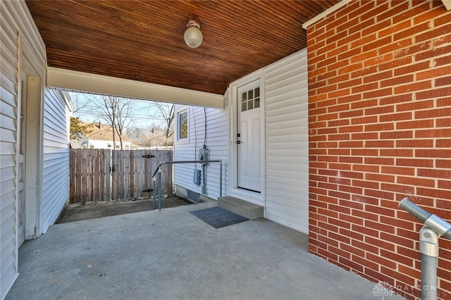 view of patio featuring entry steps and fence