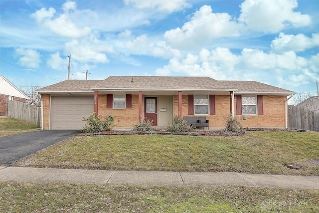 single story home featuring aphalt driveway, brick siding, fence, and an attached garage