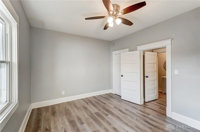 unfurnished bedroom featuring light wood finished floors and baseboards