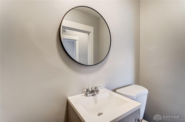 bathroom with toilet and vanity