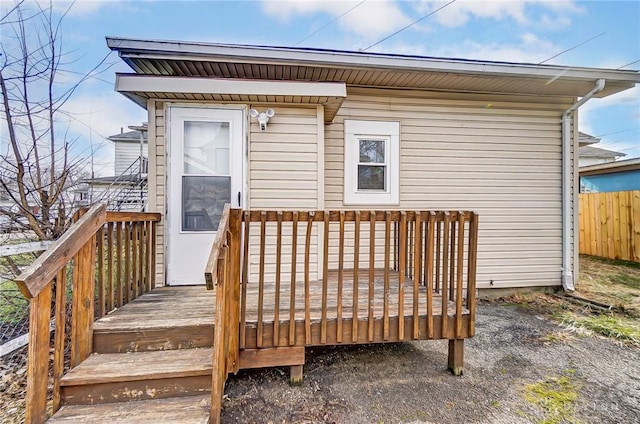 exterior space featuring fence and a wooden deck