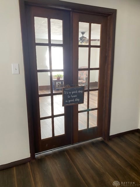 room details featuring baseboards, wood finished floors, and french doors