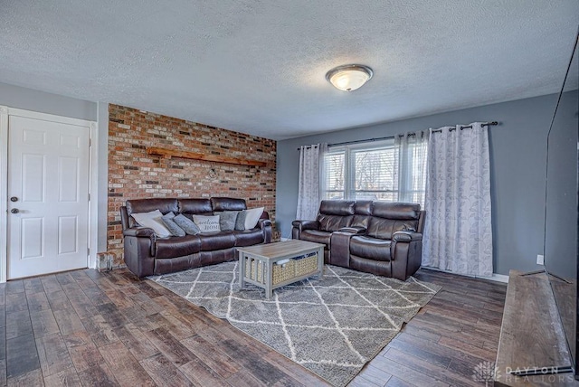 living room featuring a textured ceiling and hardwood / wood-style flooring