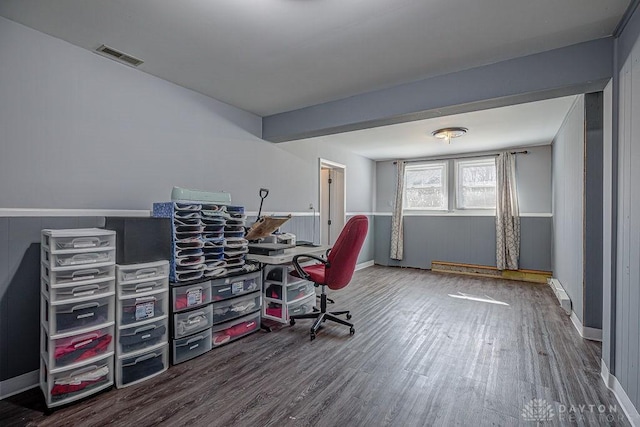 office with wood finished floors, visible vents, and baseboards