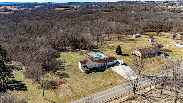 bird's eye view with a rural view and a wooded view