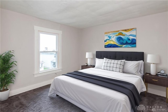 bedroom with carpet and baseboards