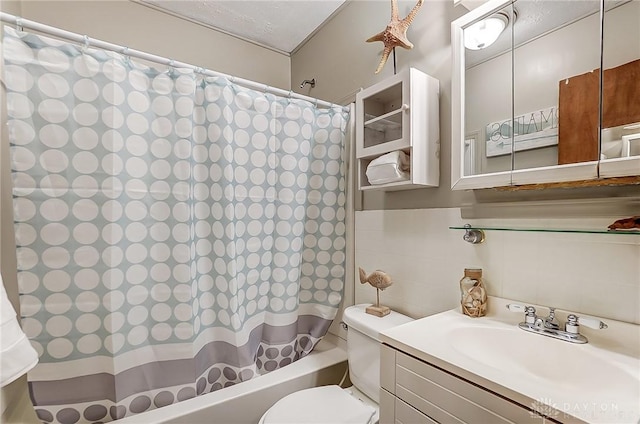 bathroom featuring shower / tub combo with curtain, tile walls, toilet, and vanity