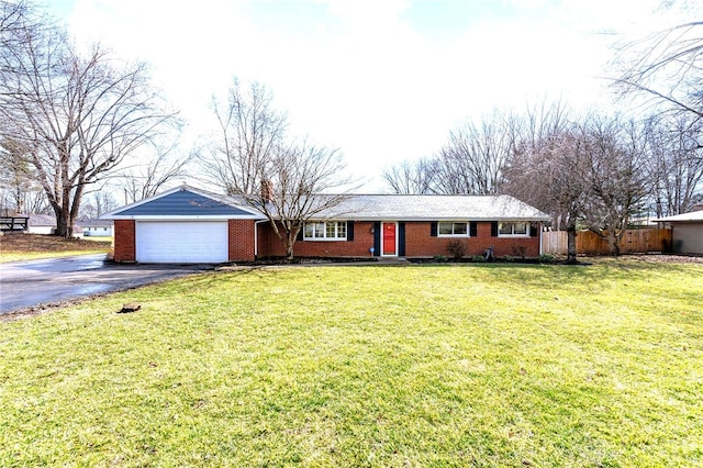 ranch-style home with aphalt driveway, brick siding, a front yard, fence, and a garage