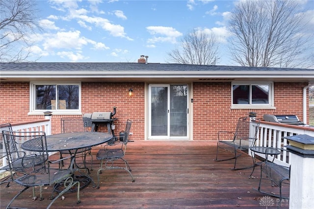 wooden deck featuring outdoor dining space