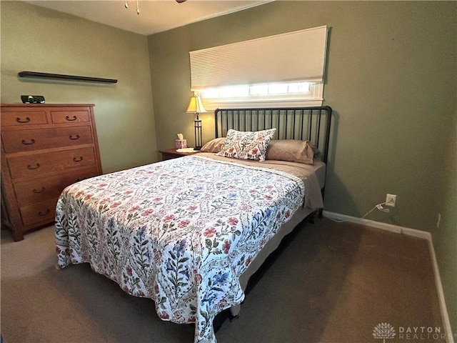 carpeted bedroom with baseboards