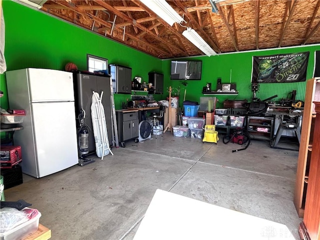 garage with freestanding refrigerator